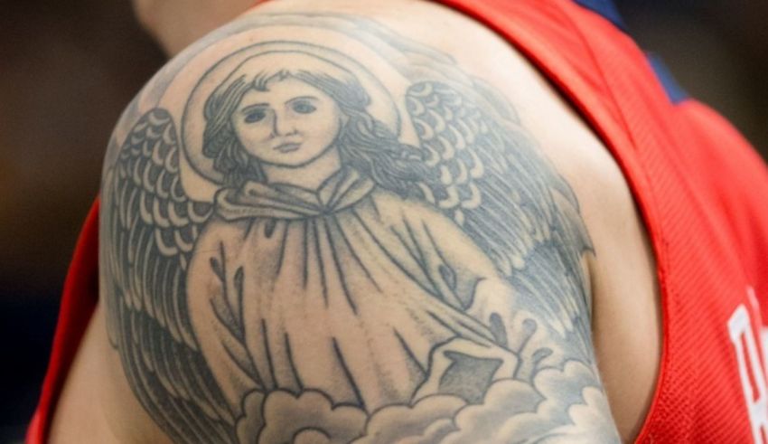 A tattoo of an angel on a basketball player's arm.