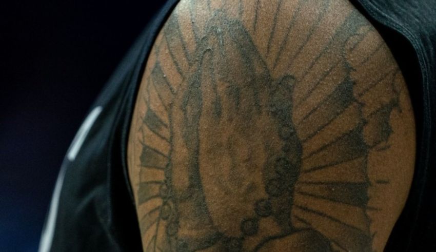 A tattoo on the arm of a basketball player.