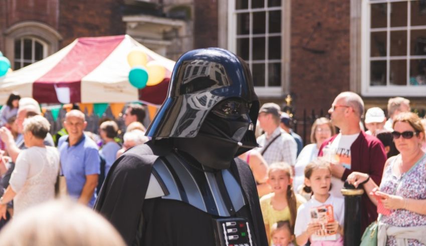 Darth vader in a crowd of people.