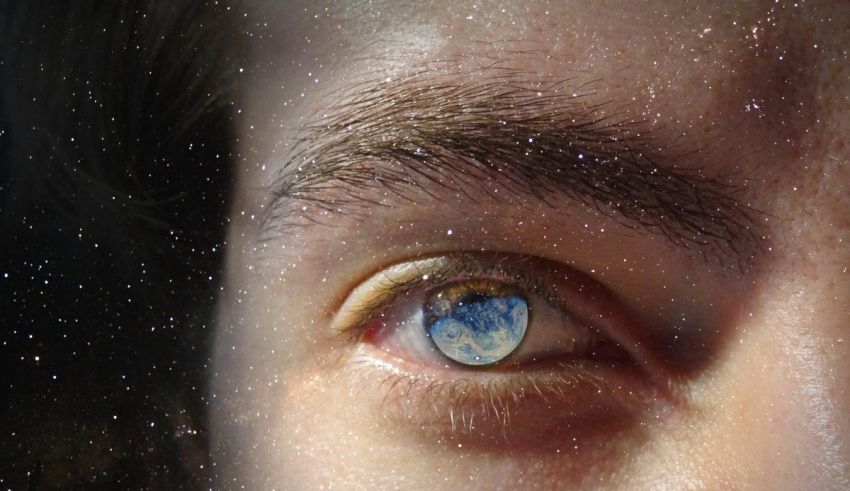 A person's eye with the earth in the background.