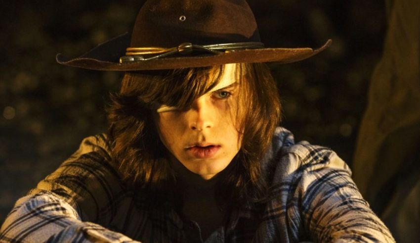 The walking dead - season 3 - a young man in a cowboy hat.