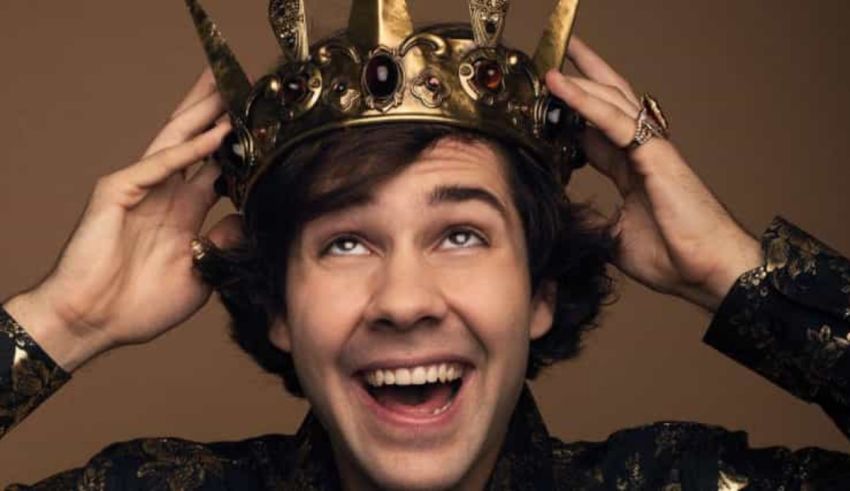 A young man with a crown on his head.