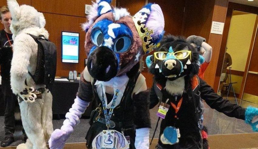 Two cosplayers in animal costumes standing next to each other.