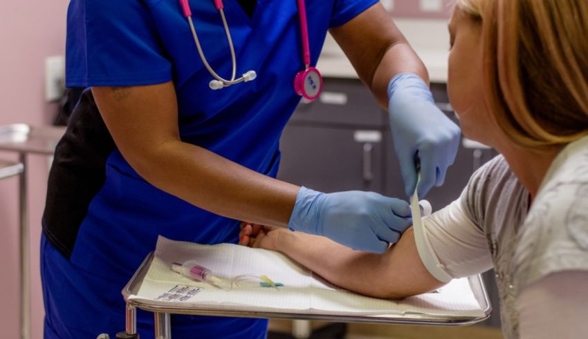 A nurse is giving a patient a blood test.
