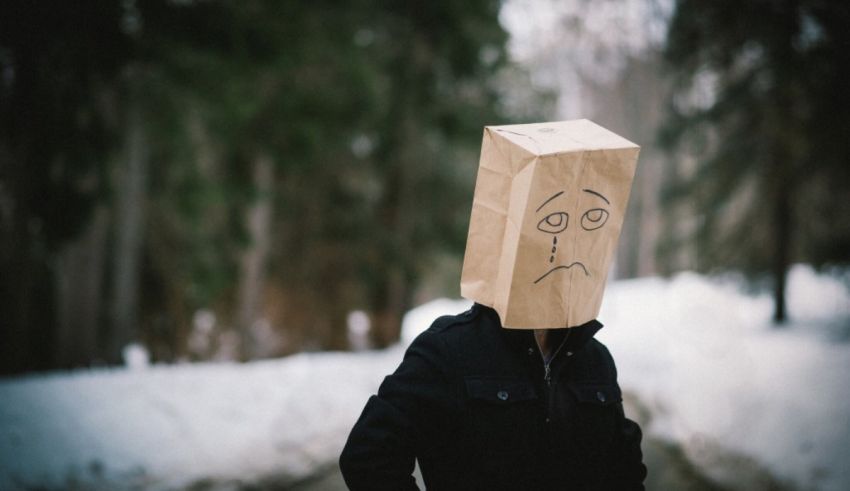 A man wearing a paper bag on his head.