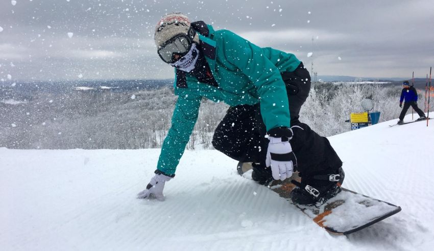 A person riding a snowboard on a snowy slope.