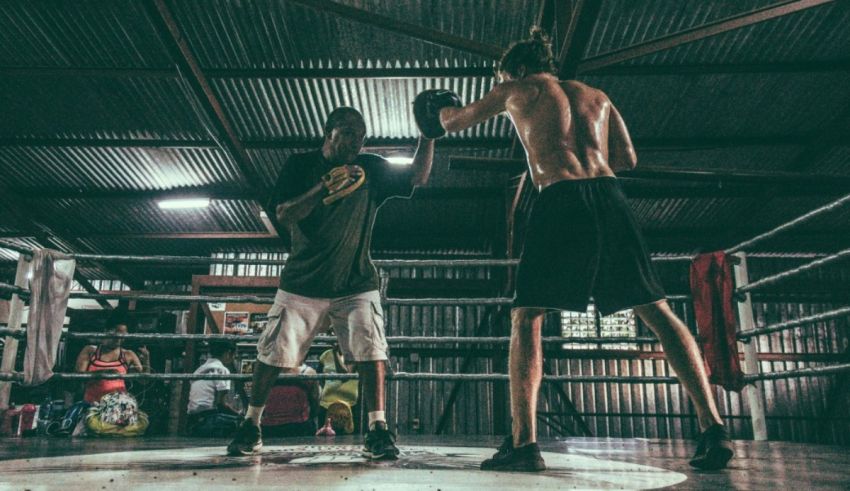 Two men boxing in a boxing ring.