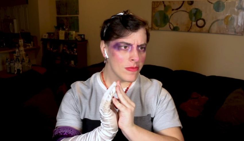 A woman with purple makeup on her face.