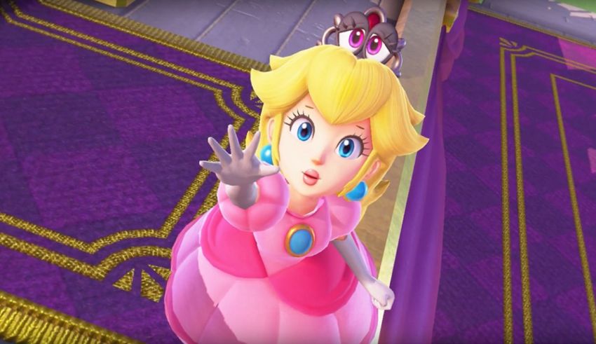 A princess in a pink dress is standing on a purple carpet.