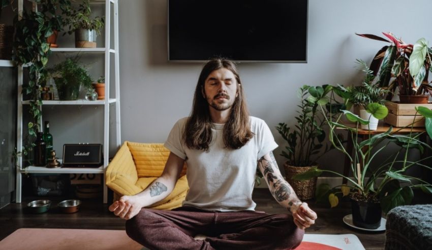 A man meditating in his living room.