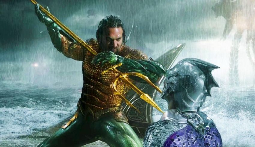 Aquaman and a man with a sword in the water.