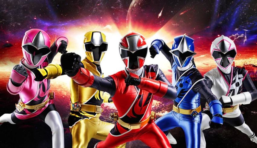 A group of power rangers posing in front of a starry sky.