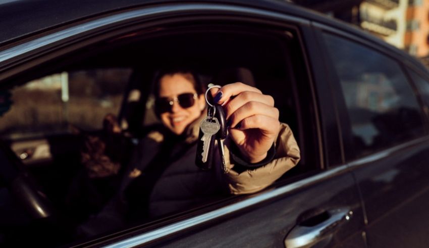 A woman holding a car key in her hand.