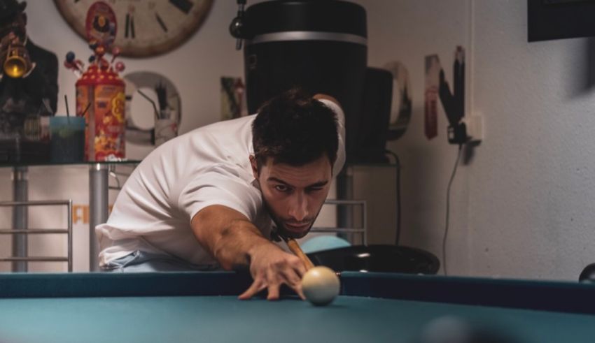 A man leaning over a pool table.