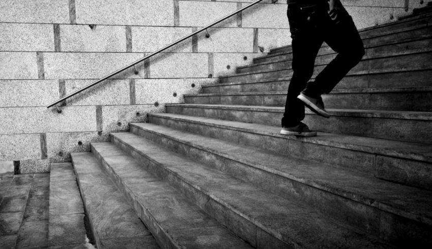 A person is walking down a set of stairs.