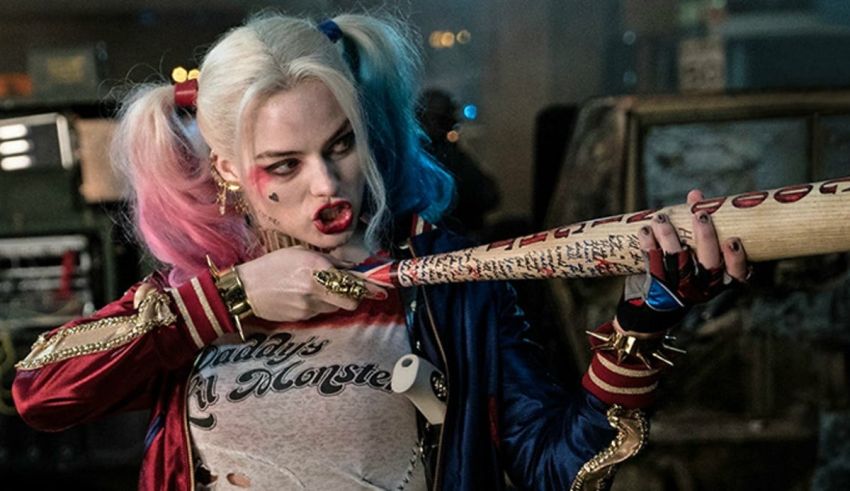 Harley quinn is holding a baseball bat.