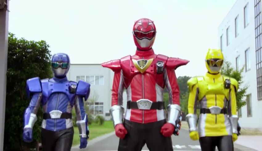 Three power rangers standing next to each other.