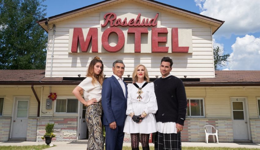 A group of people standing in front of a motel.