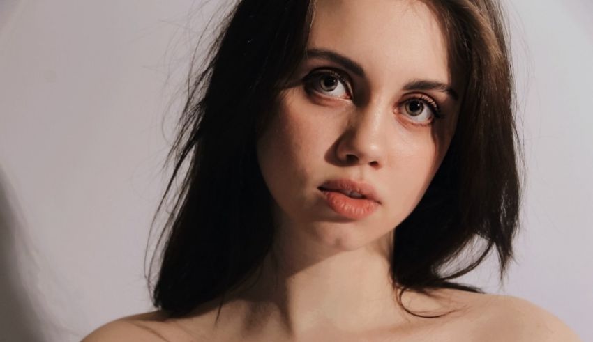 A close up of a young woman with dark hair.