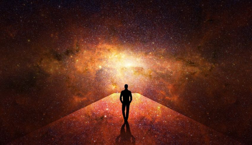 The silhouette of a person standing on a path in space.