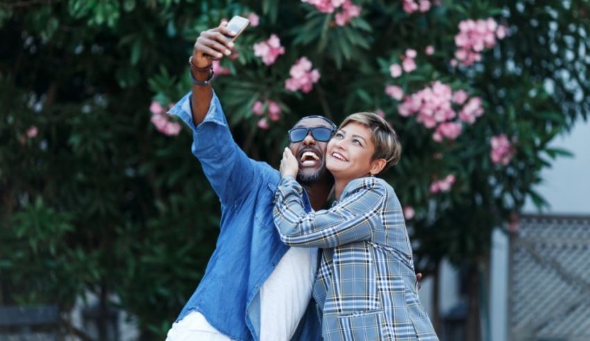 A man and woman taking a selfie.