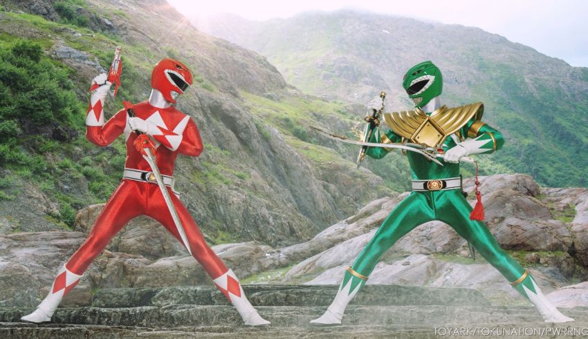 Two green and red power rangers standing next to each other.