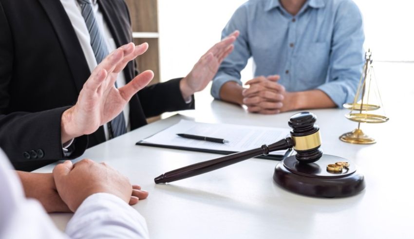 A businessman is talking to a judge in a courtroom.