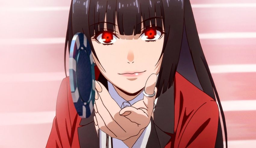 A girl with long black hair and red eyes is holding a phone.