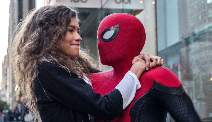 A woman is hugging a spider - man in front of a city.