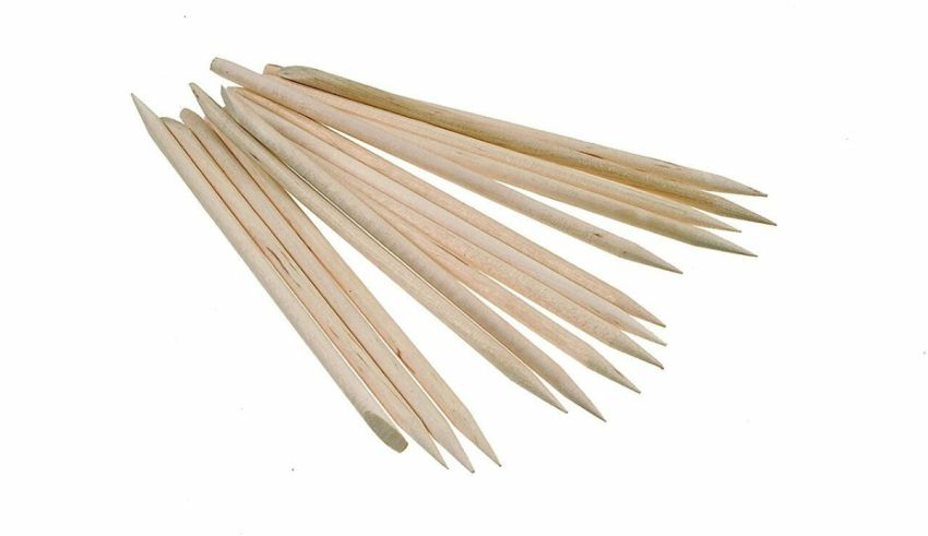 A group of wooden toothpicks on a white background.