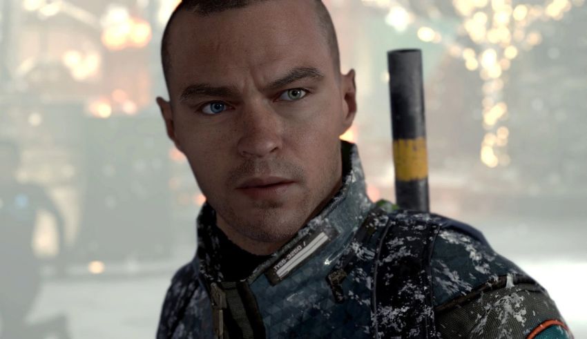 A man with blue eyes is holding a baseball bat.