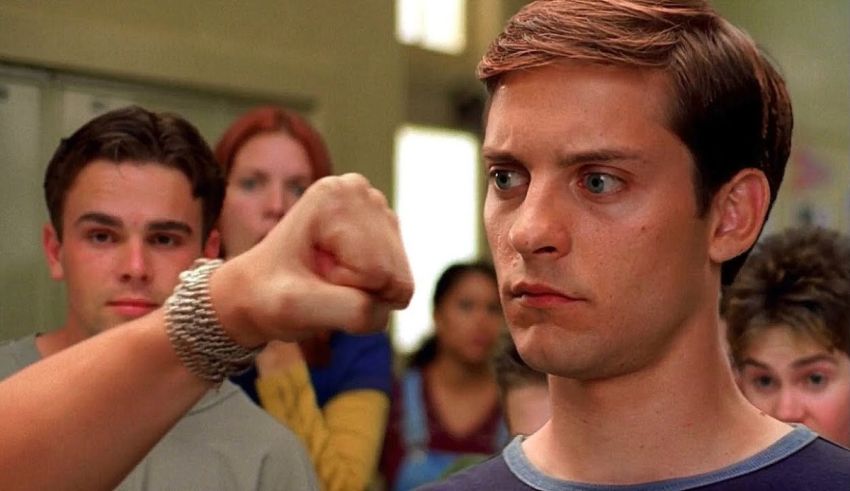 A man is pointing his fist at a group of people.