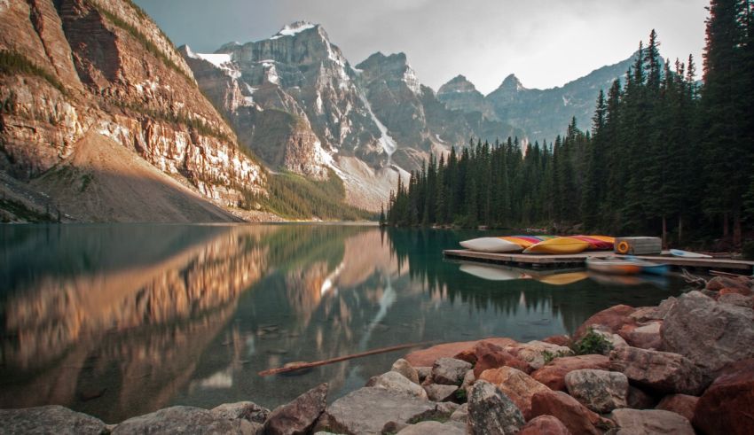 Canoes are docked in a lake.