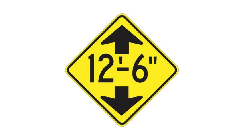 A yellow and black sign with arrows pointing in different directions.