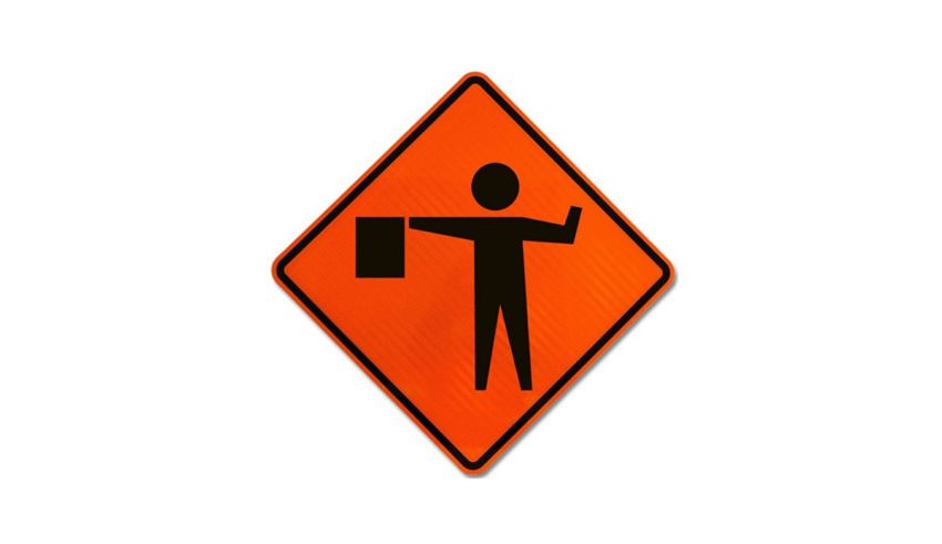 A black and orange sign with a man holding a bag.