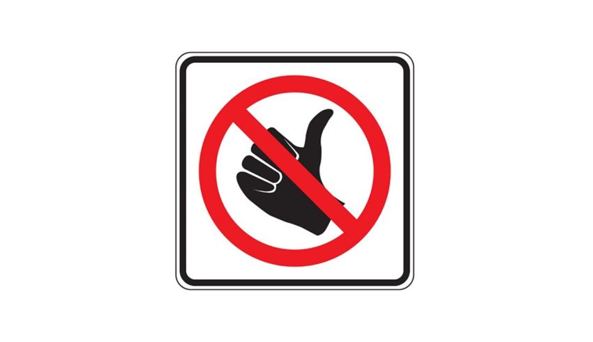 A no thumbs up sign on a white background.