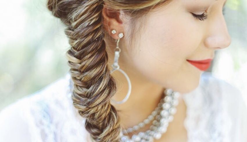 A woman with long hair in a fishtail braid.
