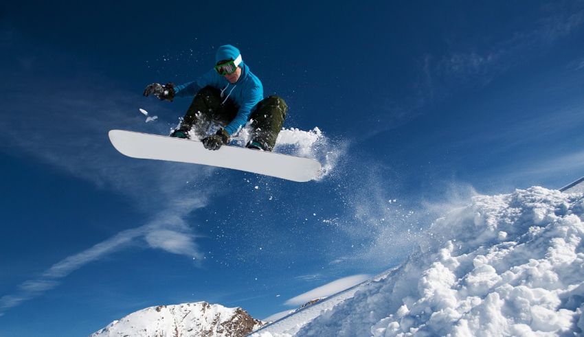 A snowboarder doing a trick in the air.