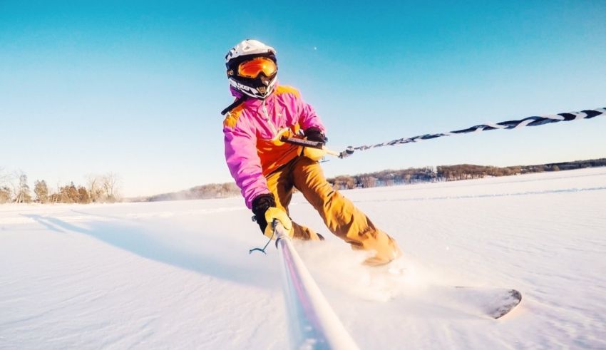 A person skiing down a snowy slope with a pole.