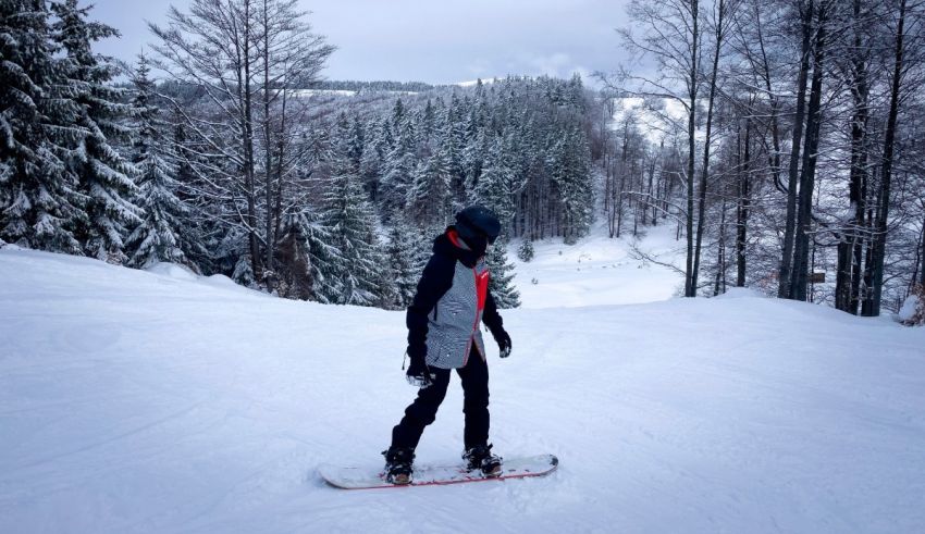 A person on a snowboard on a snowy slope.