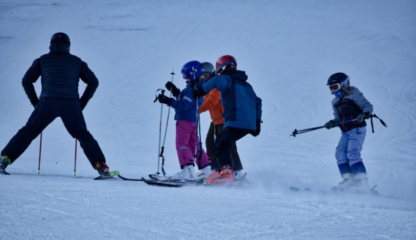 A group of people on skis on a snowy slope.