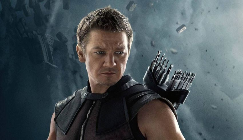 The avengers - hawkeye is holding a bow and arrow.