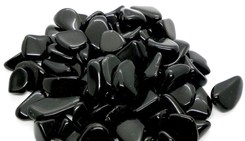 A pile of black stones on a white background.