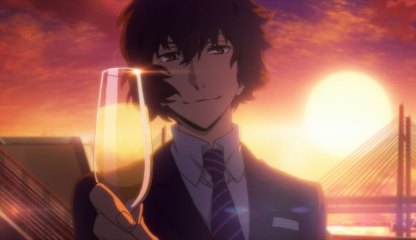 A man in a suit holding a glass of wine.