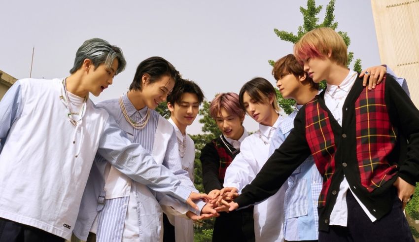 A group of young men holding hands in front of a building.