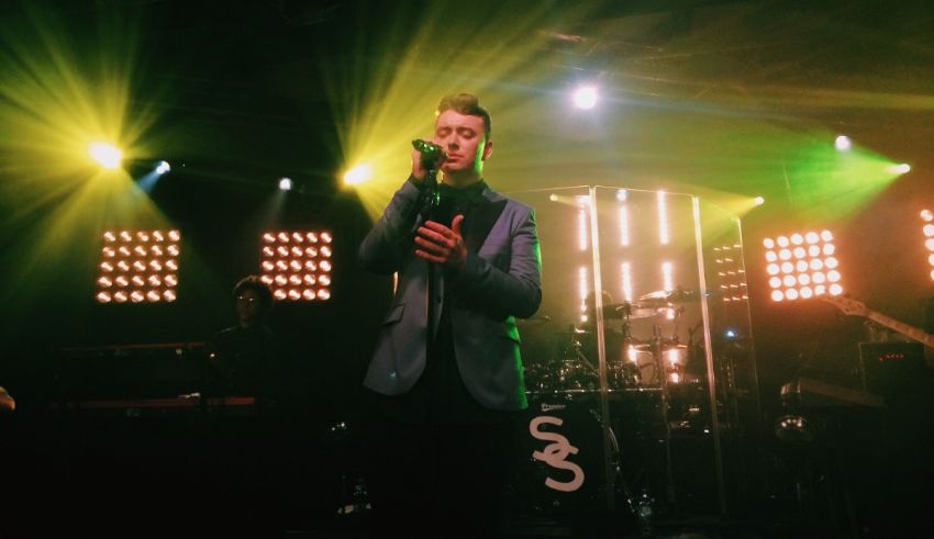 A man in a suit singing into a microphone.