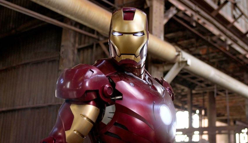 A man in an iron man suit is standing in a warehouse.