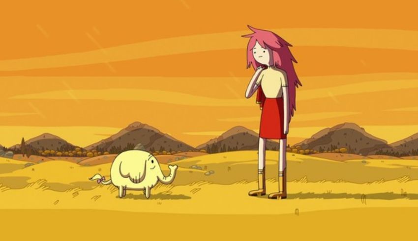 A girl is standing next to a yellow bird in the desert.