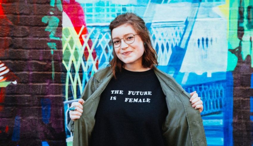 A woman wearing a t - shirt that says the future is female.