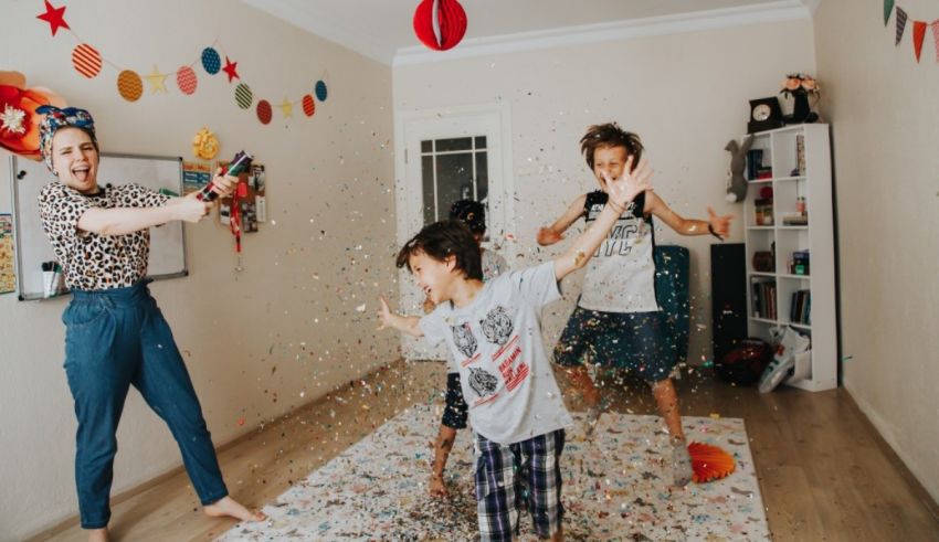 A family playing with confetti in a living room.